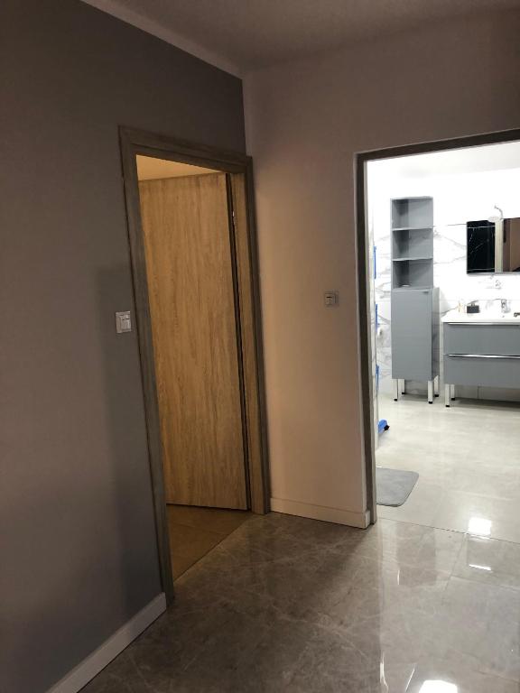 Televízia a/alebo spoločenská miestnosť v ubytovaní Apartament Telkom 2