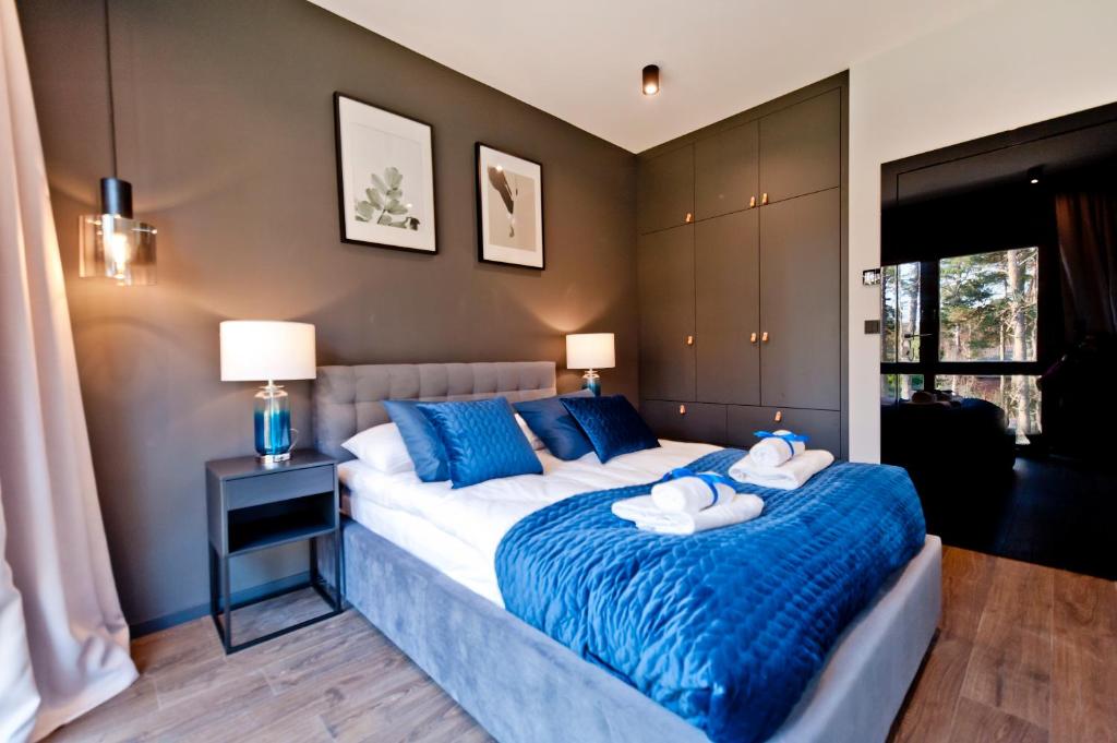 Posteľ alebo postele v izbe v ubytovaní BlueApart Verano Residence