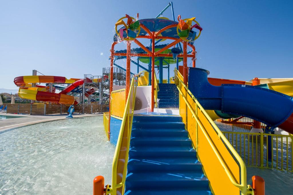 a water park with a slide in the water at Selini Suites & Waterpark in Kolymvari