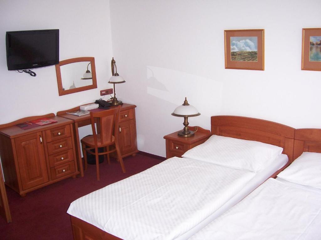 Postel nebo postele na pokoji v ubytování Hotel Pegas Brno