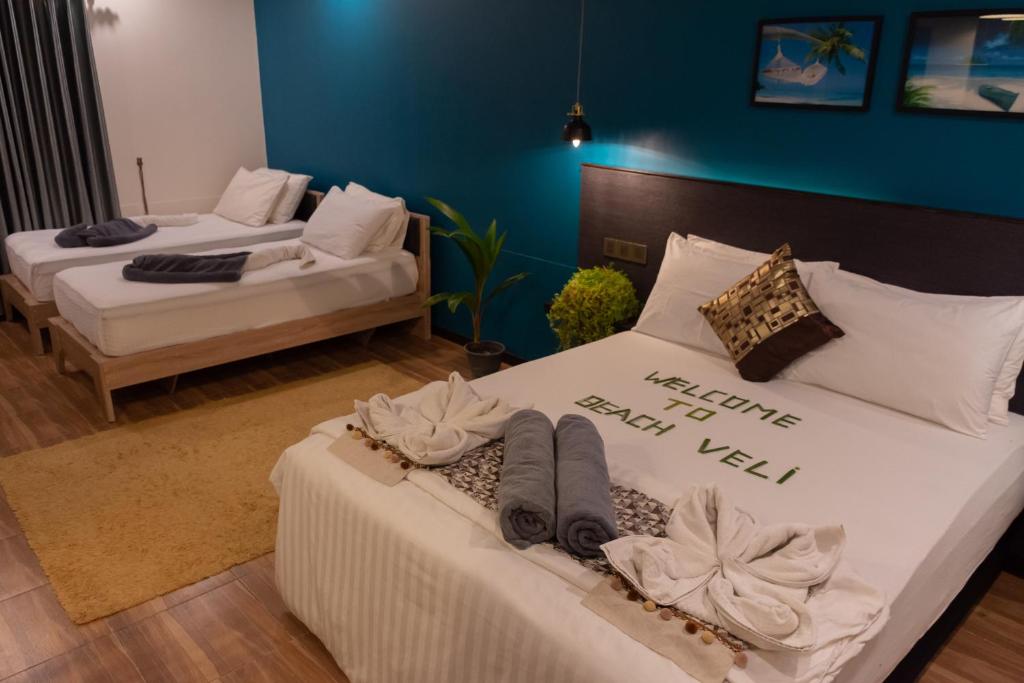 Postel nebo postele na pokoji v ubytování Beach Veli