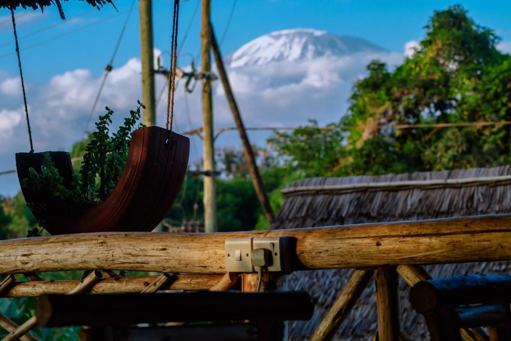 a view of a snow covered mountain in the distance at Kilimanjaro Summit Lodge in Moshi