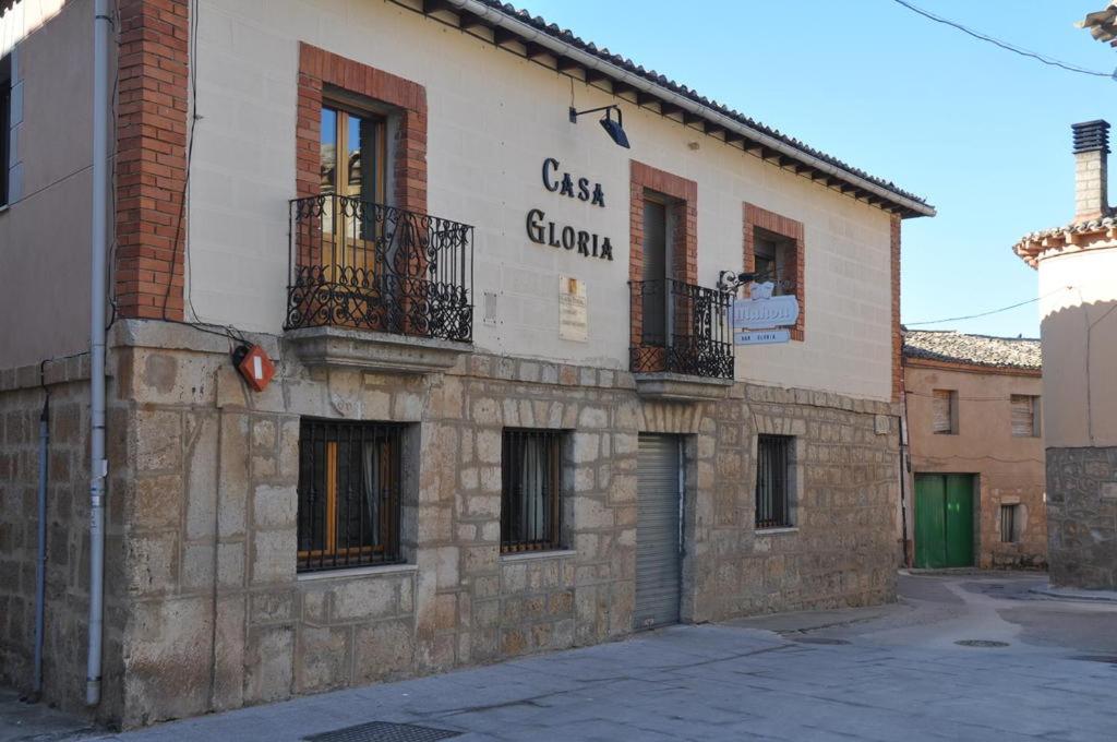 a building with a sign on the side of it at Casa Gloria in Sasamón