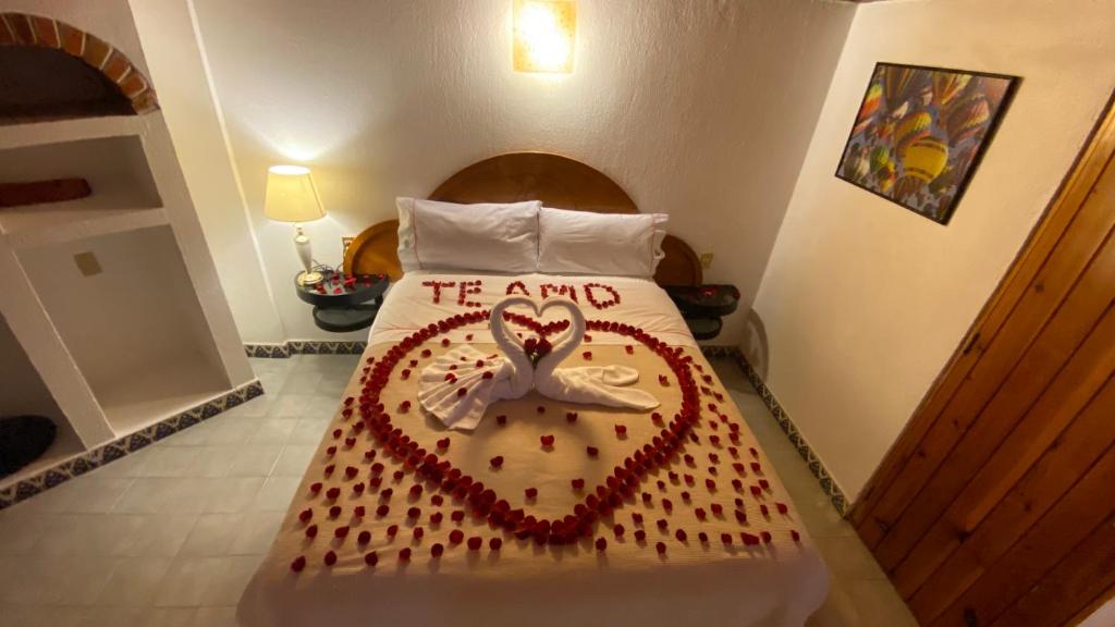 Postel nebo postele na pokoji v ubytování Suites Paraiso Tequis