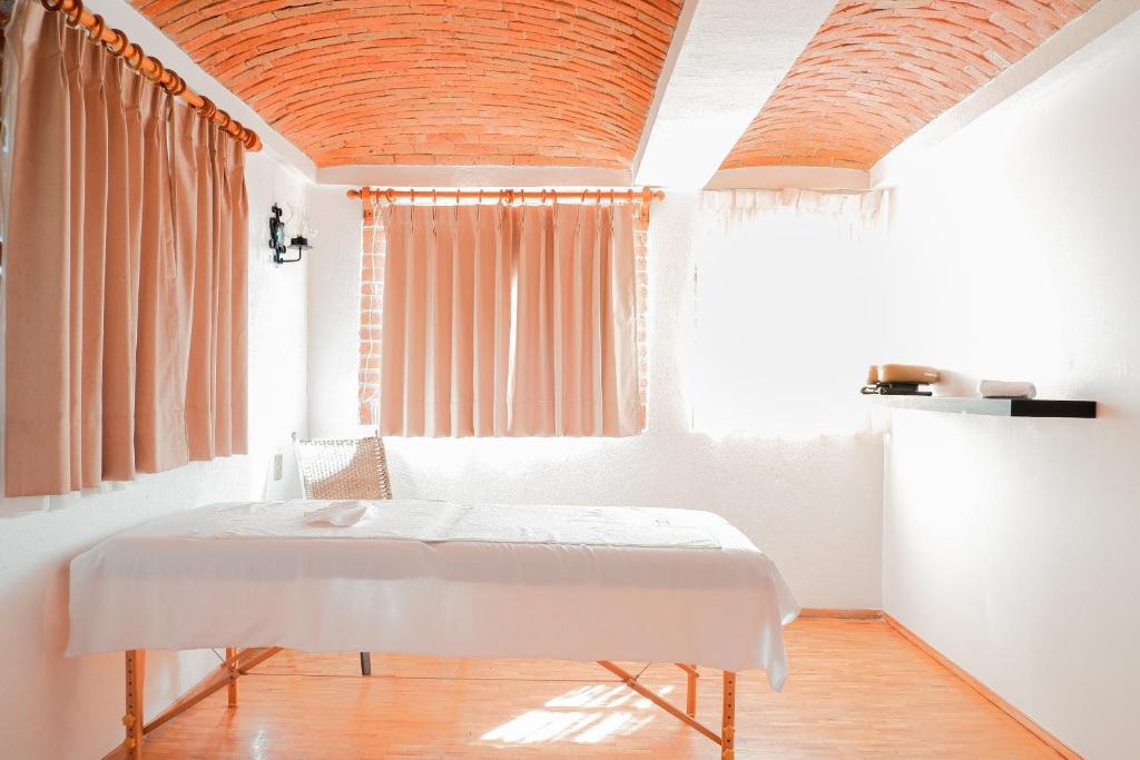 Postel nebo postele na pokoji v ubytování Suites Paraiso Tequis