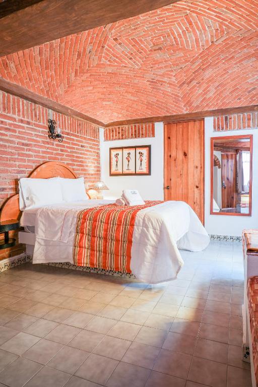 Postel nebo postele na pokoji v ubytování Suites Paraiso Tequis