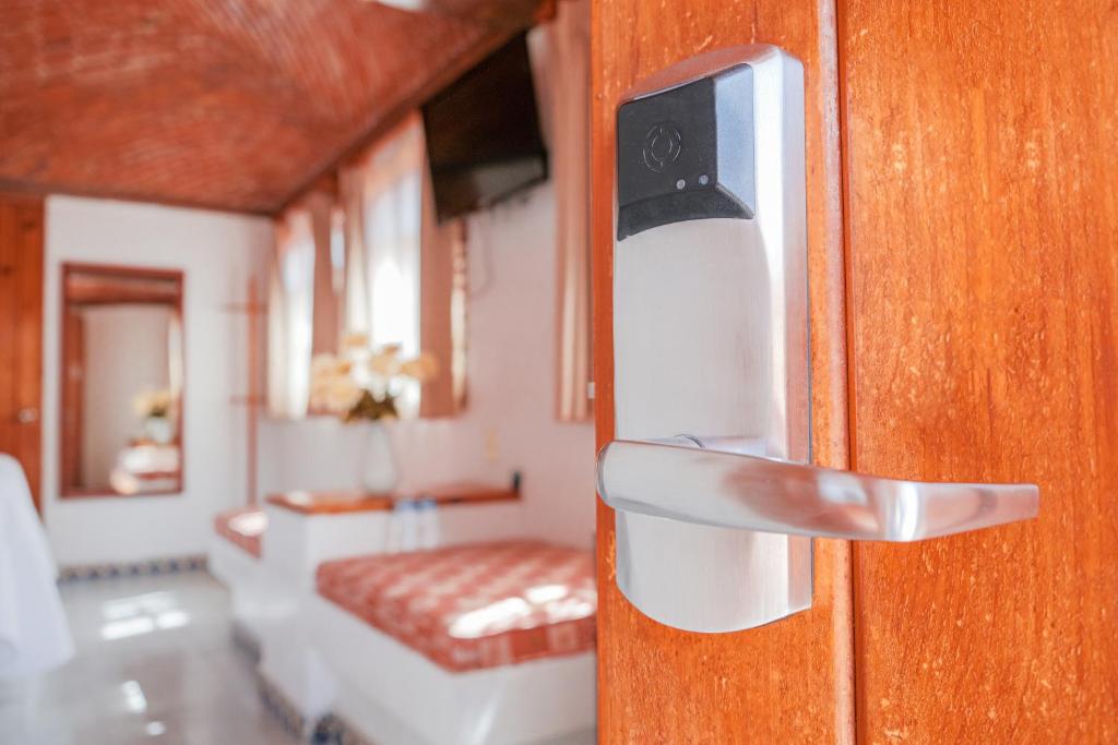 Postel nebo postele na pokoji v ubytování Suites Paraiso Tequis