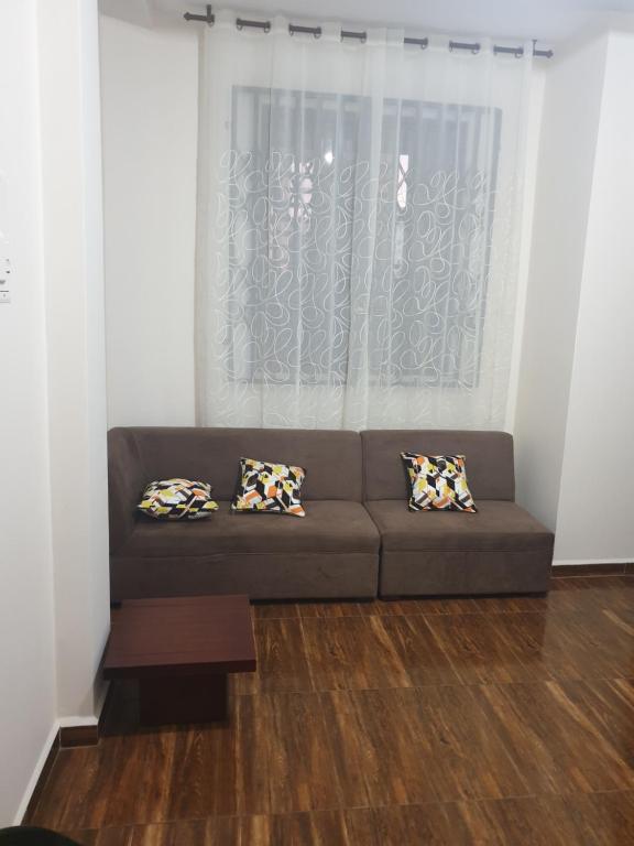a living room with a couch and a window at CRUCITALIA suite x 4 in Crucita