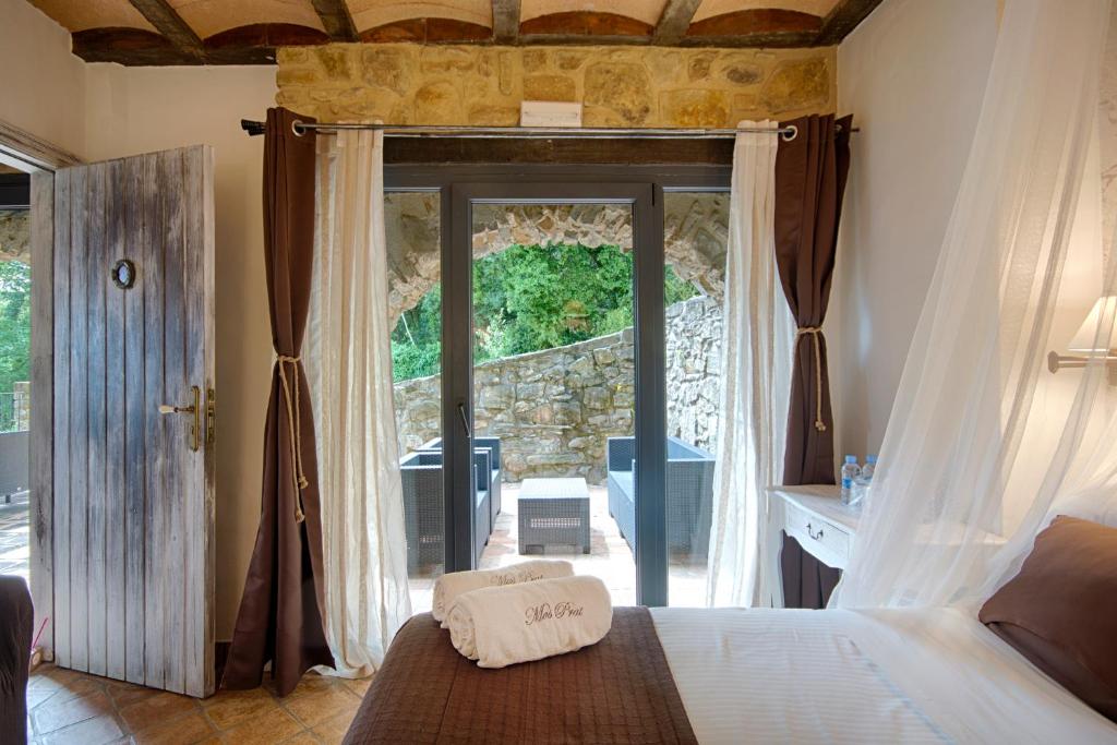 Postel nebo postele na pokoji v ubytování Hotel Rural & Spa Mas Prat