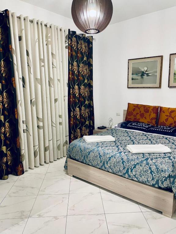 Posteľ alebo postele v izbe v ubytovaní CASA DEI FIORI