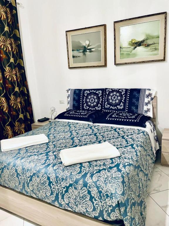 Posteľ alebo postele v izbe v ubytovaní CASA DEI FIORI