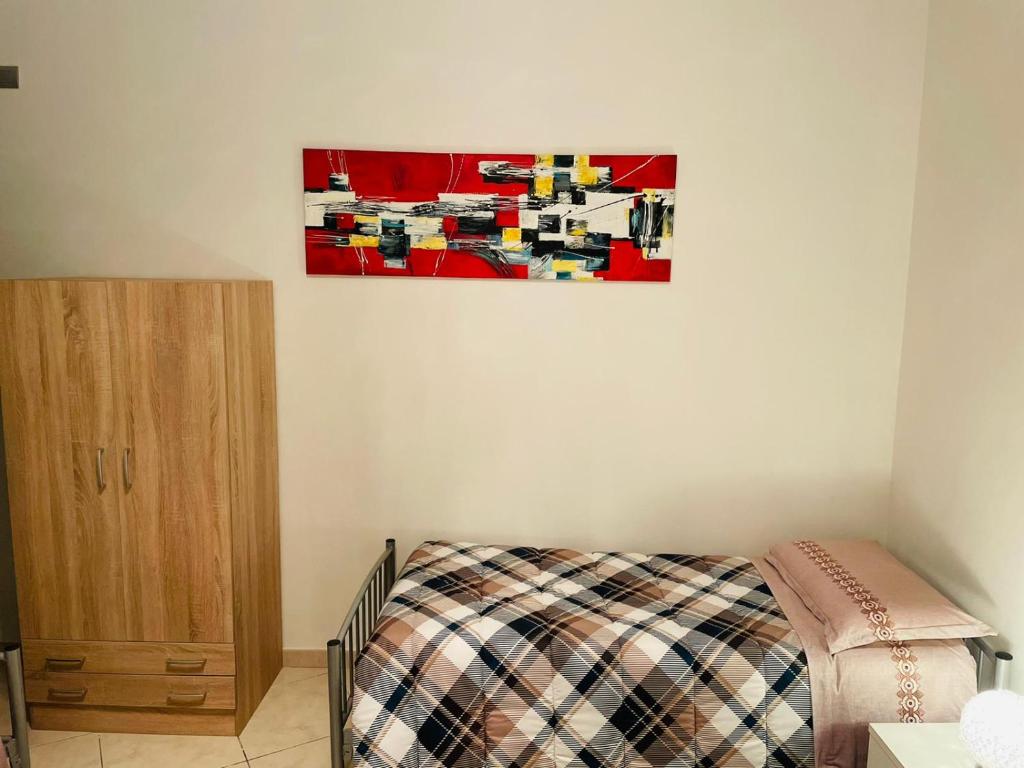Postel nebo postele na pokoji v ubytování Casa Dei Fiori 3