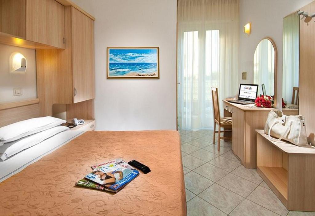 Postel nebo postele na pokoji v ubytování Hotel Lido