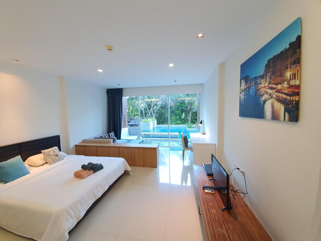 Postel nebo postele na pokoji v ubytování Mida de Sea Residence Hua Hin