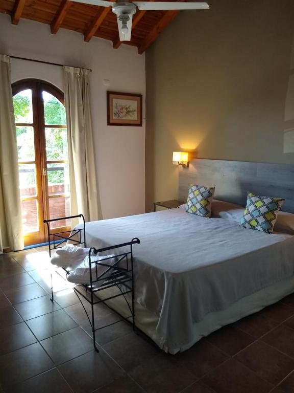 Postel nebo postele na pokoji v ubytování Hotel Tunuyan