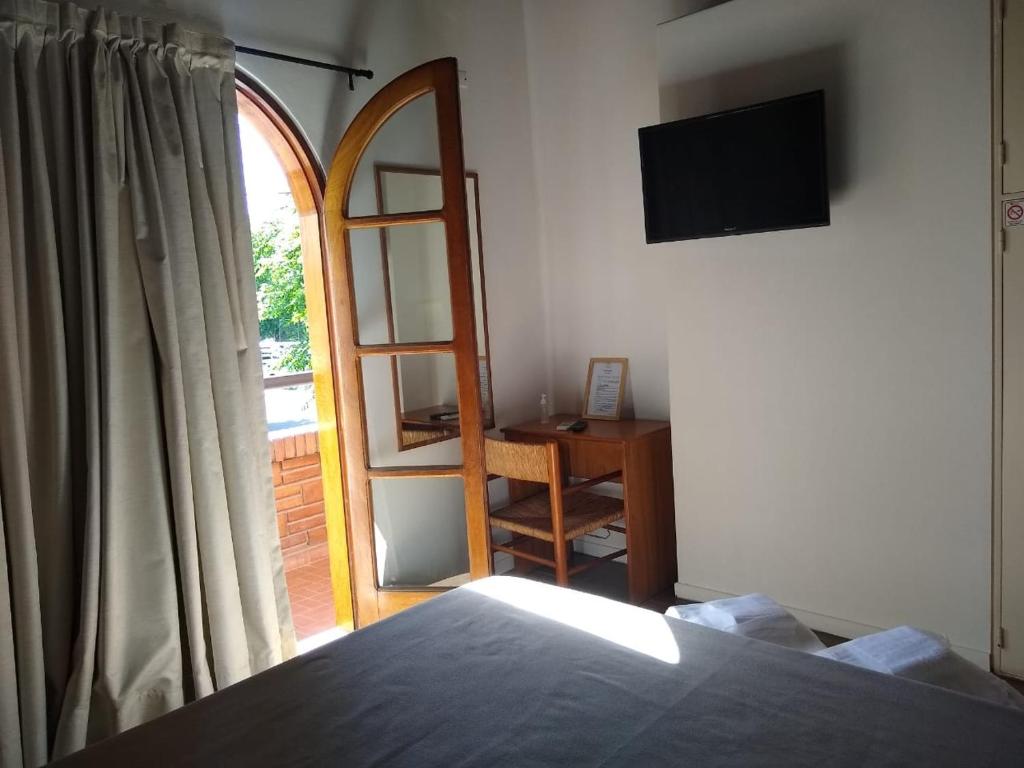 Postel nebo postele na pokoji v ubytování Hotel Tunuyan