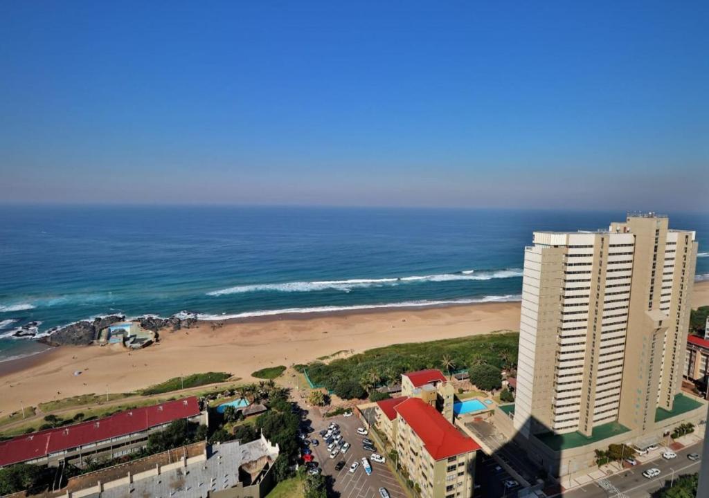 an aerial view of a beach and buildings and the ocean at Breathtaking Sea Views at High Tide 1803 in Amanzimtoti