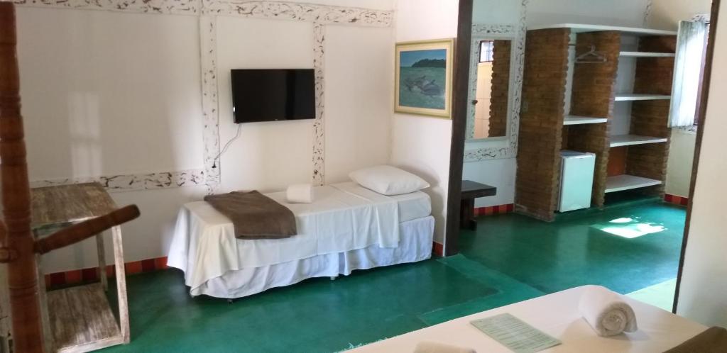 Cama ou camas em um quarto em Pousada Macunaima