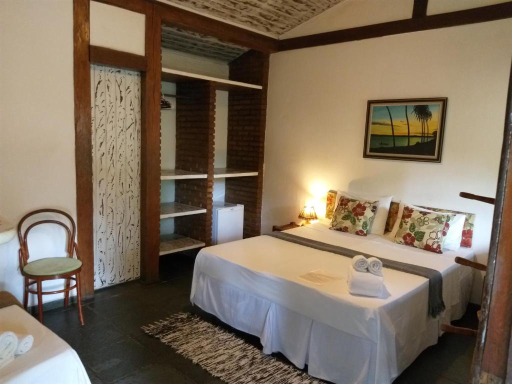 Cama ou camas em um quarto em Pousada Macunaima