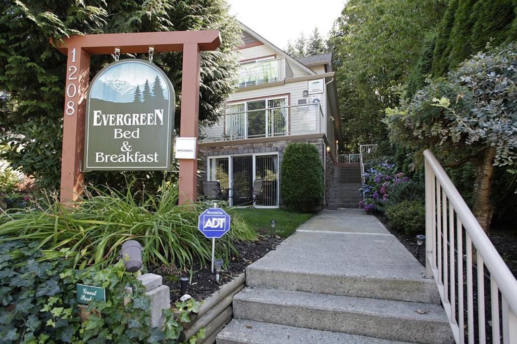 a building with a sign on the side of it at Evergreen Bed & Breakfast in Hope