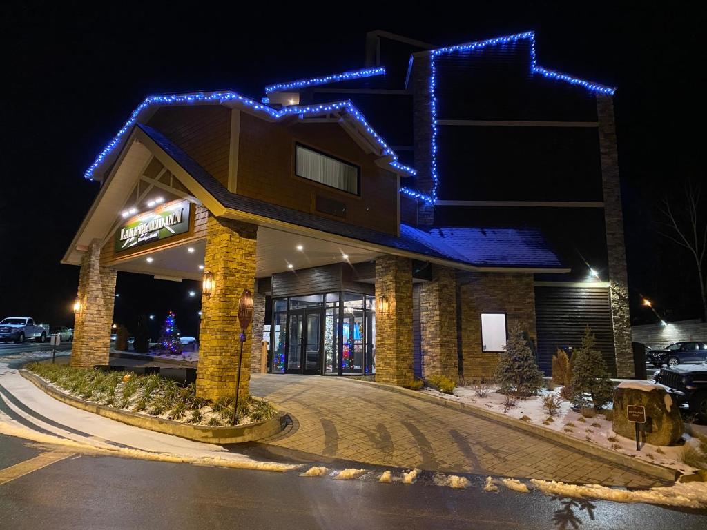 a building with blue lights on top of it at Lake Placid Inn Boutique Hotel in Lake Placid