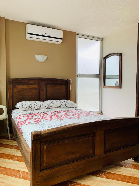 Postel nebo postele na pokoji v ubytování Hotel Kemarios
