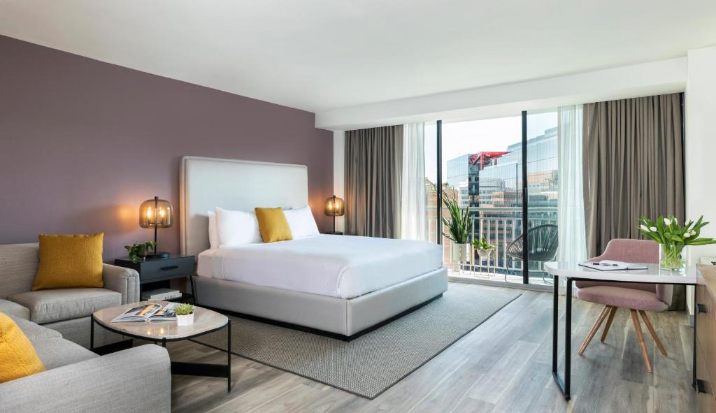 a hotel room with a bed and a couch at Hotel Madera in Washington, D.C.