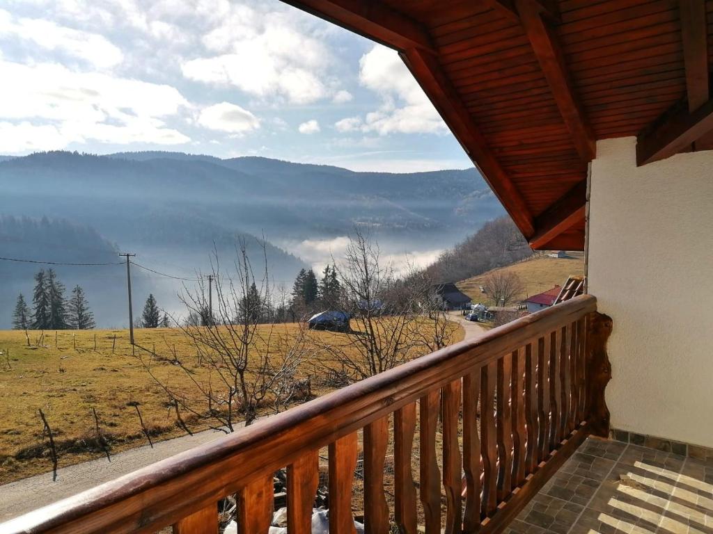 a balcony of a house with a view of the mountains at Apartmani Dunja Zlatar in Nova Varoš