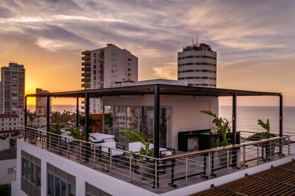 a balcony of a building with a view of the ocean at Oz Hotel Luxury in Cartagena de Indias