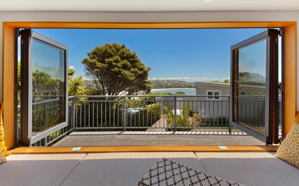 an open balcony with a view of the ocean at The Cove at Little O in Oneroa