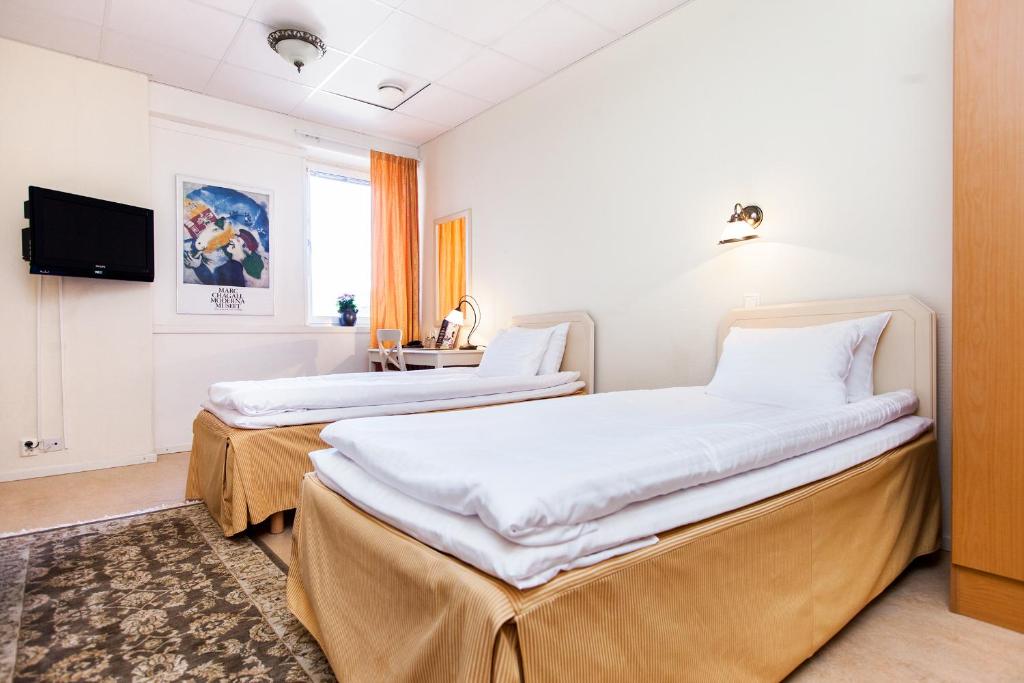Postel nebo postele na pokoji v ubytování Hotel Expo Stockholm