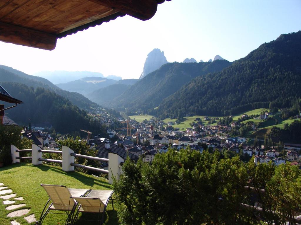 a view of a town in the mountains from a house at Cësa Marmolada 1318 in Ortisei
