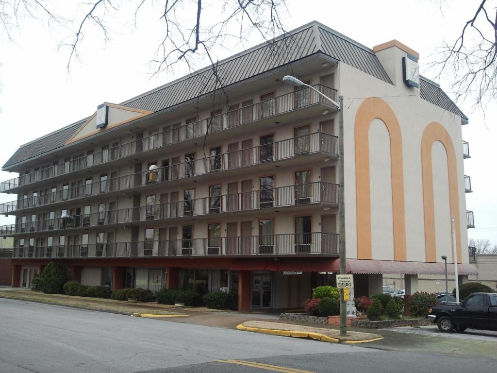 a large apartment building with a lot of windows at Studio 9 Inn & Suites in Decatur