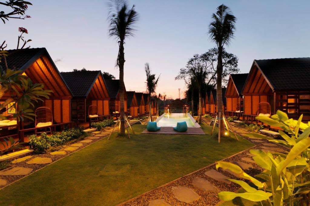 a courtyard of a resort with a playground at Bingin Lodge Uluwatu in Uluwatu
