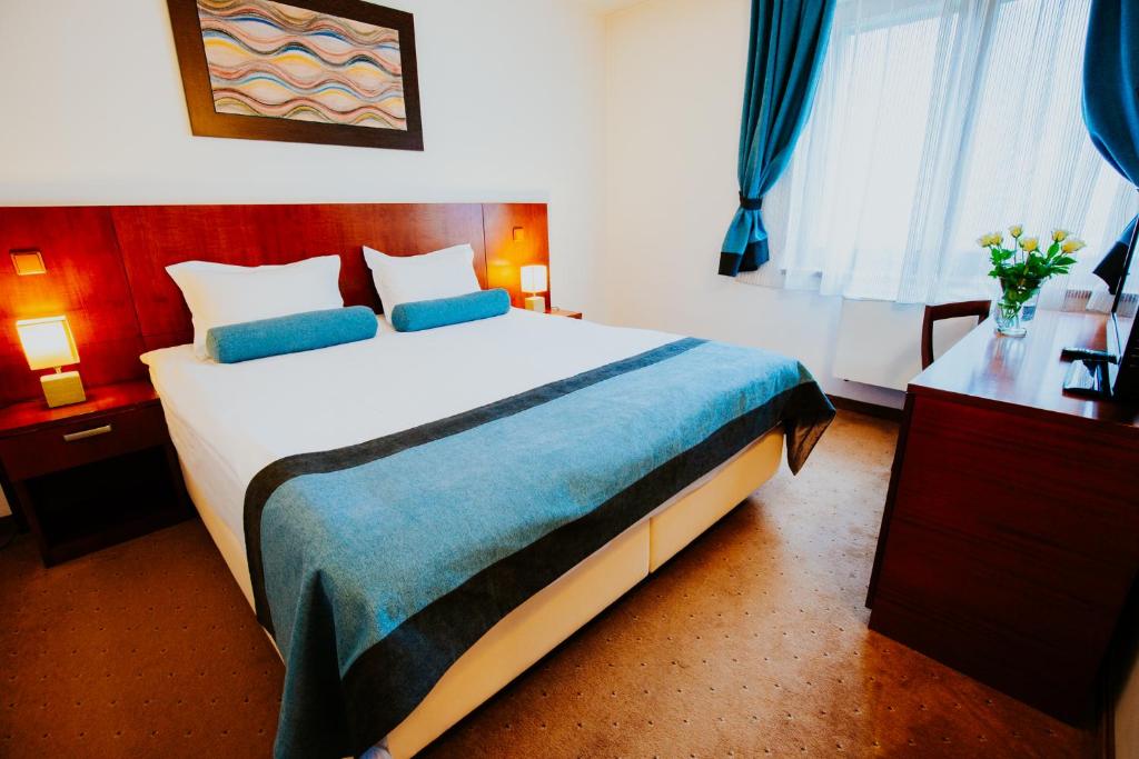 Postel nebo postele na pokoji v ubytování Hotel O3zone