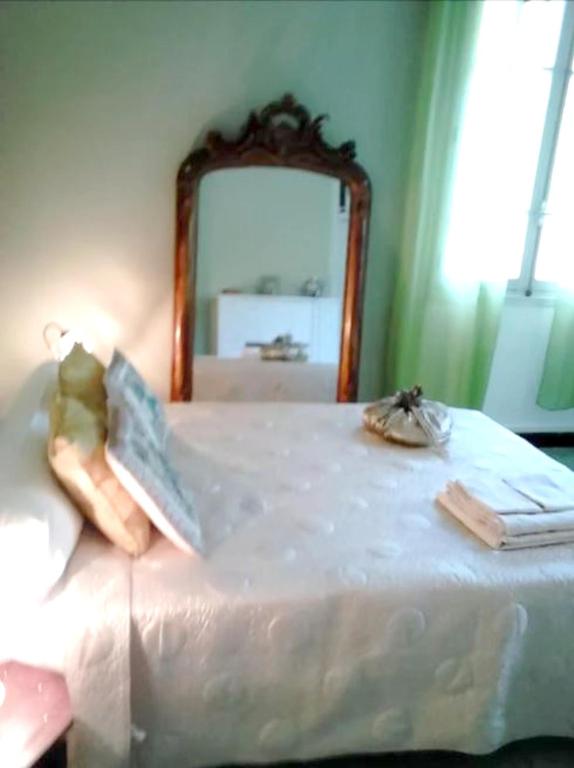 Postel nebo postele na pokoji v ubytování Appartement cosy au cœur de Bocognano avec vue sur montagne