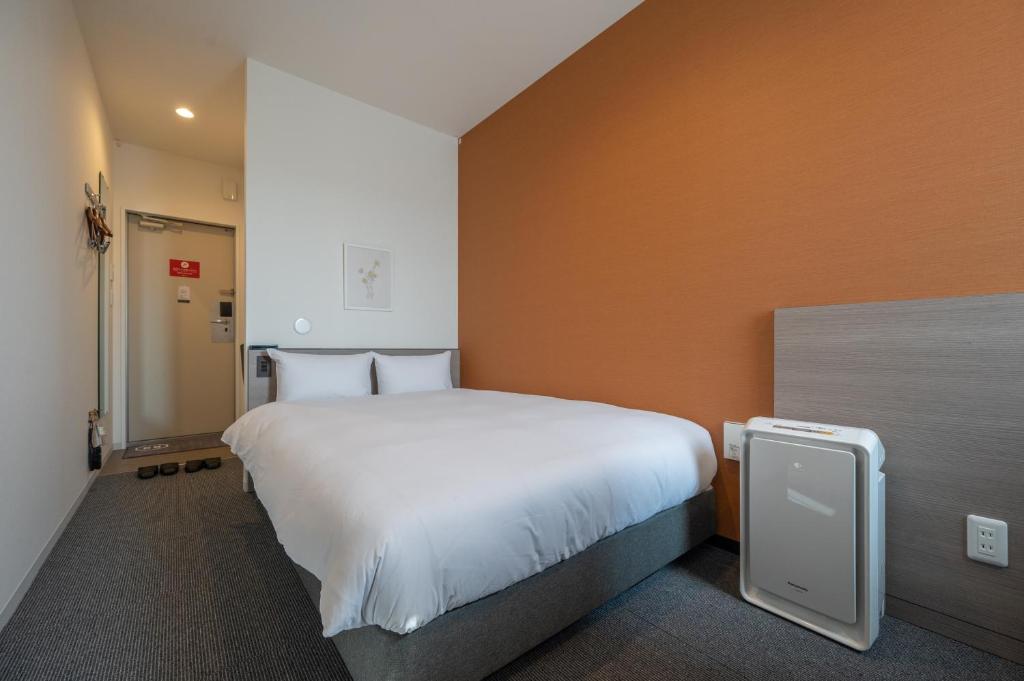Postel nebo postele na pokoji v ubytování HOTEL R9 The Yard Utsunomiya chuo