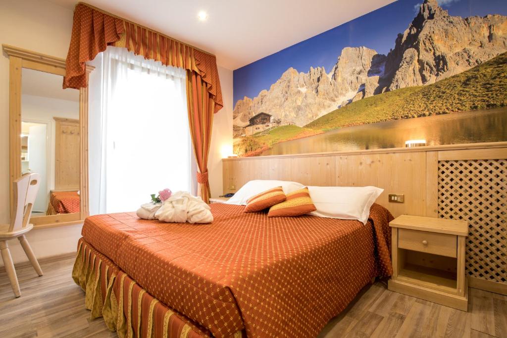 Postel nebo postele na pokoji v ubytování Hotel Touring