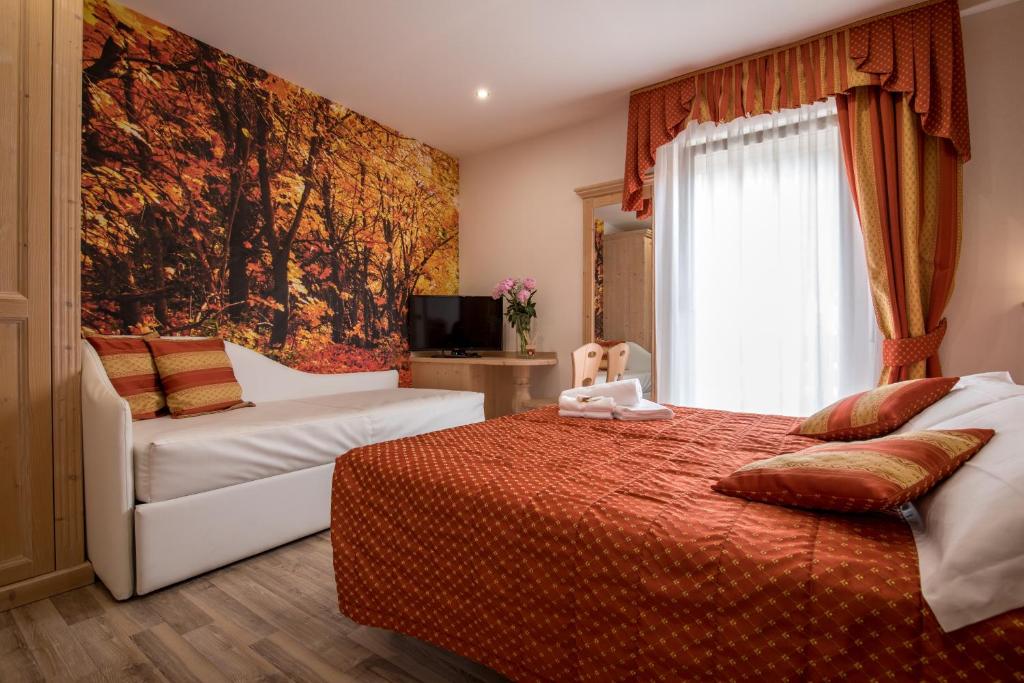Postel nebo postele na pokoji v ubytování Hotel Touring