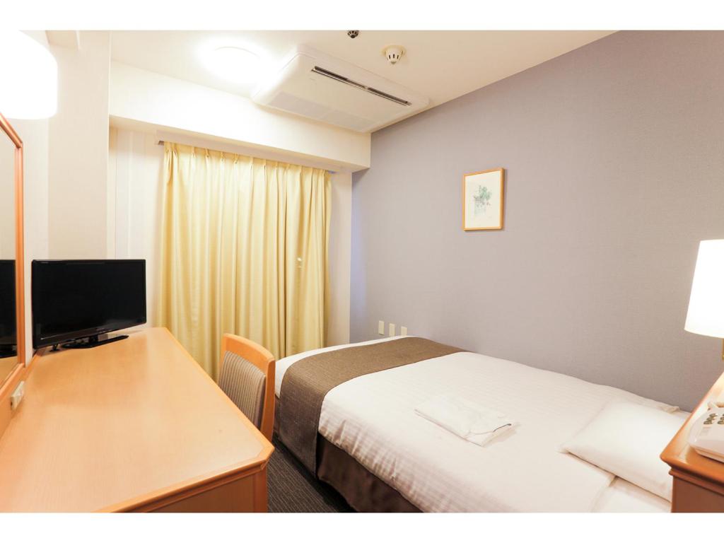 TV a/nebo společenská místnost v ubytování Smile Hotel Wakayama