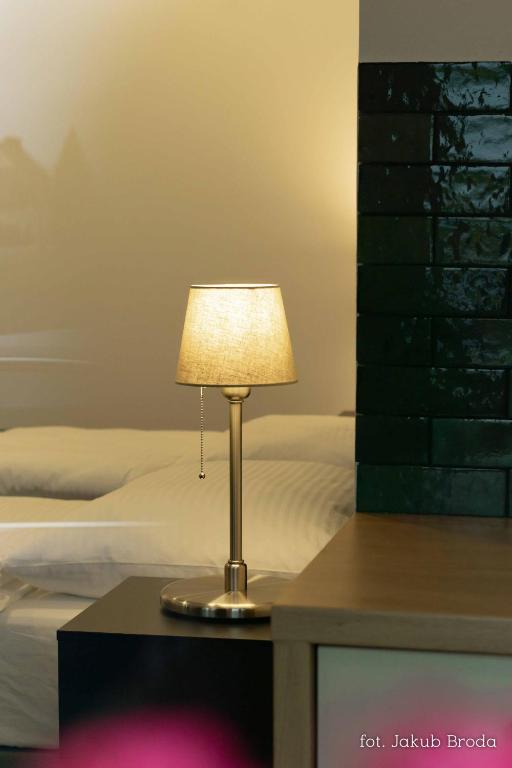 Postel nebo postele na pokoji v ubytování Apartamenty Toszeckie