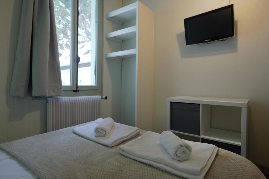 Postel nebo postele na pokoji v ubytování Vert Lodge Chamonix