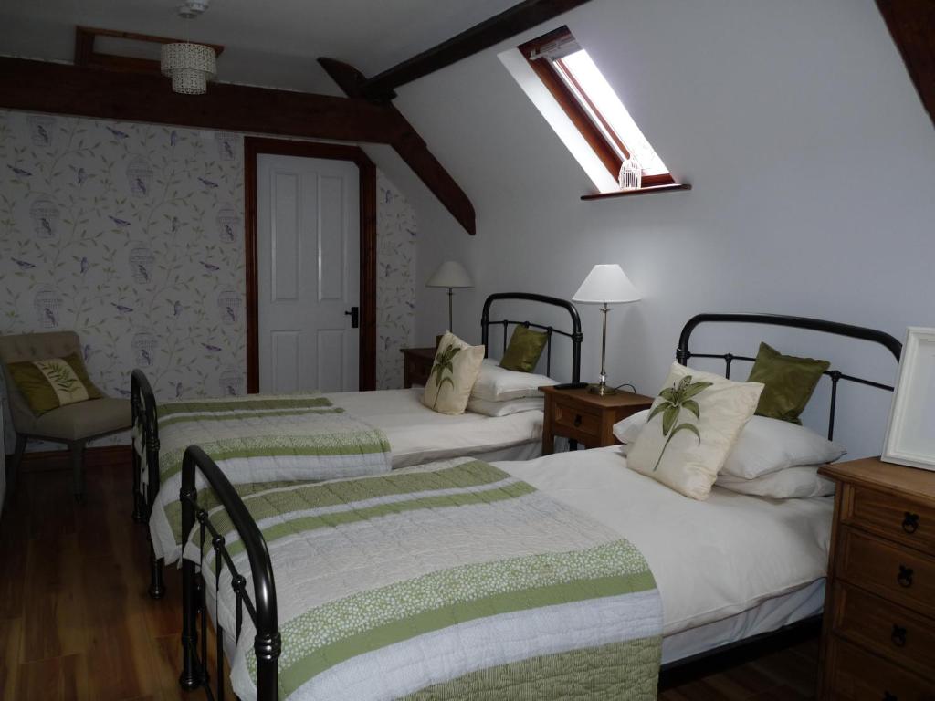 Postel nebo postele na pokoji v ubytování Stirabout Lane B&B