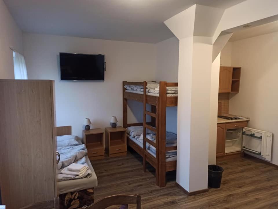 Postel nebo postele na pokoji v ubytování penzion U Kmotra