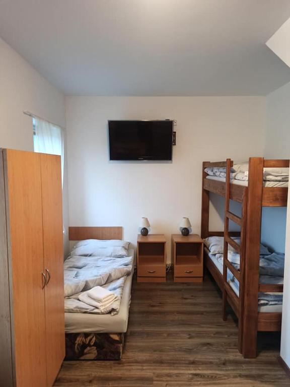 Postel nebo postele na pokoji v ubytování penzion U Kmotra