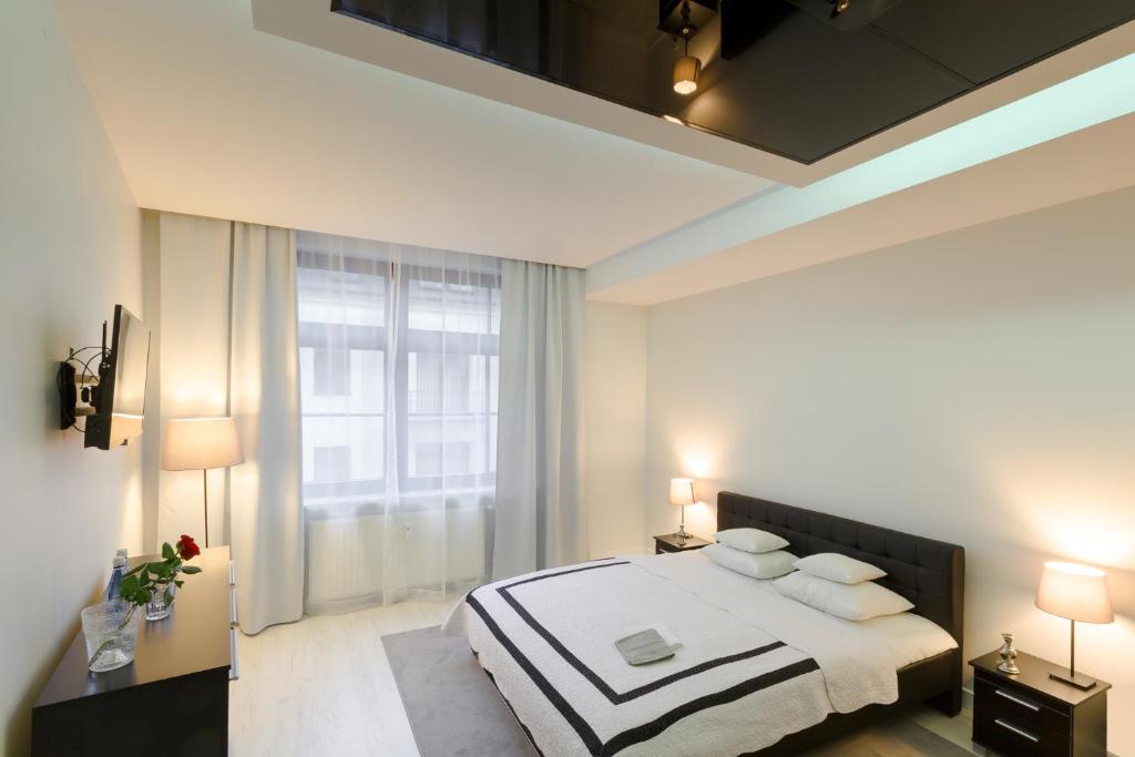 Postel nebo postele na pokoji v ubytování Prestige Apartamenty VINCI Centrum
