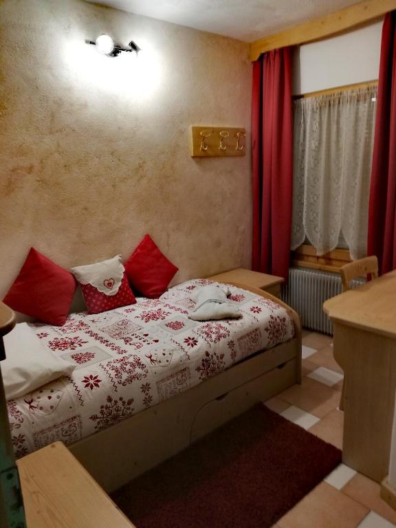 Postel nebo postele na pokoji v ubytování Albergo Vittoria