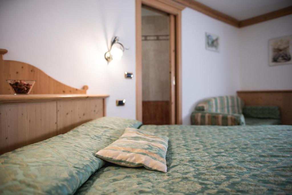 Postel nebo postele na pokoji v ubytování Hotel Touring