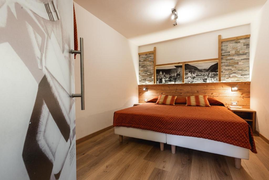 Postel nebo postele na pokoji v ubytování Hotel Touring