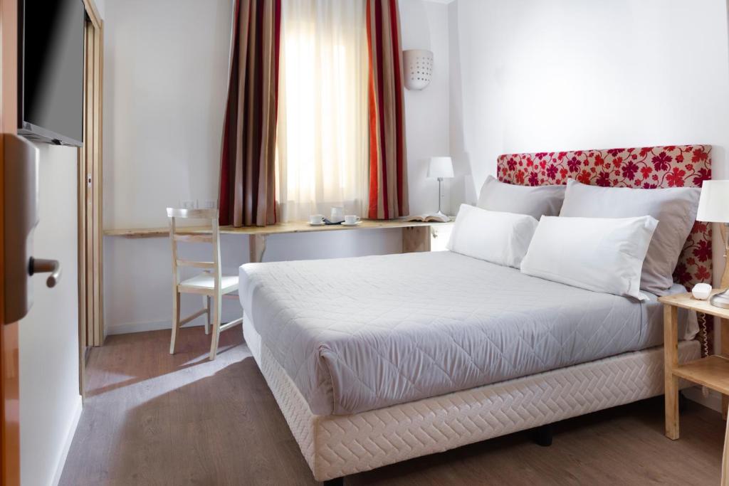 Postel nebo postele na pokoji v ubytování Hotel LaMorosa